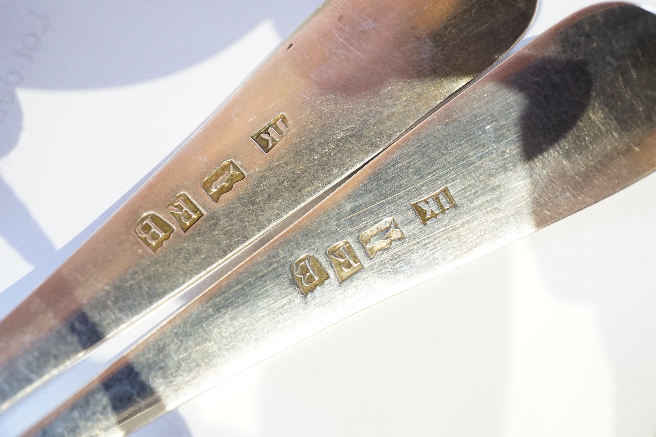 A set of three George III Scottish Provincial silver Old English shell pattern toddy ladles, by John Keith, Banff, circa 1795-1800, together with an early Victorian Scottish Provincial fiddle and shell pattern toddy ladl